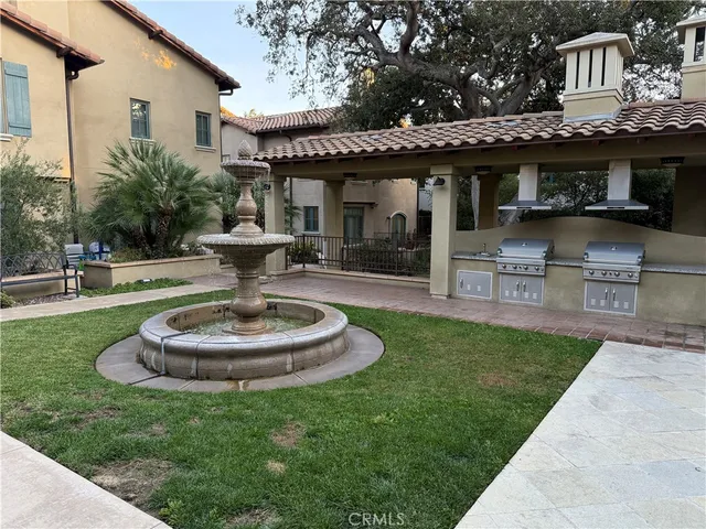 a view of a house with swimming pool and a garden