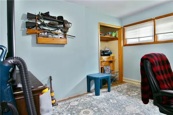 a view of workspace with furniture and window
