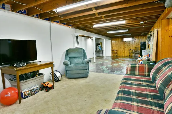 a room with furniture and a flat screen tv