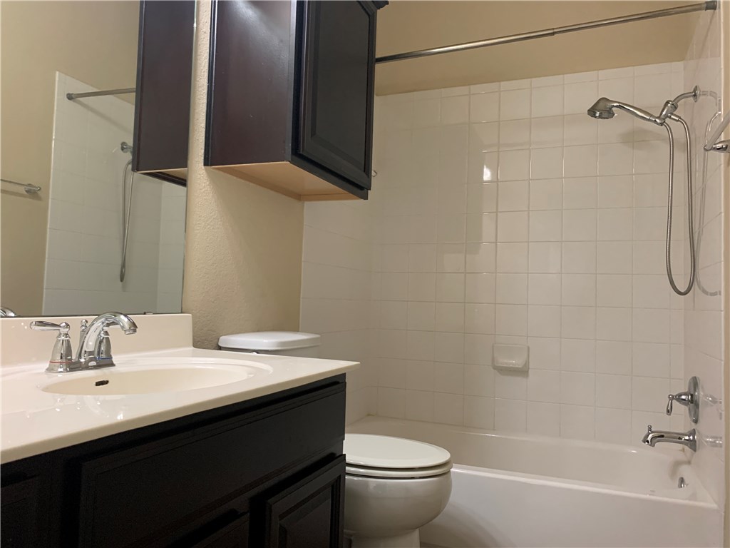 14001 Avery Ranch Boulevard, Unit 2902 Austin, TX 78717 - Photo 11 of 14 a bathroom with a sink a toilet and shower