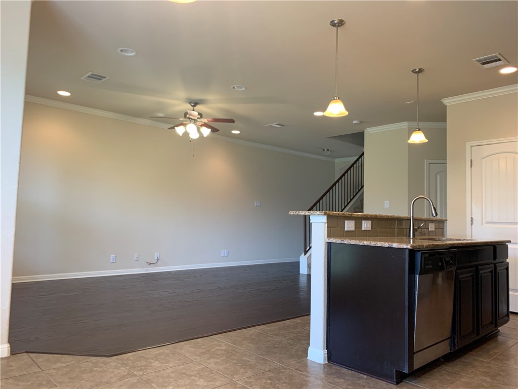 14001 Avery Ranch Boulevard, Unit 2902 Austin, TX 78717 - Photo 3 of 14 a view of a kitchen with a sink and chandelier