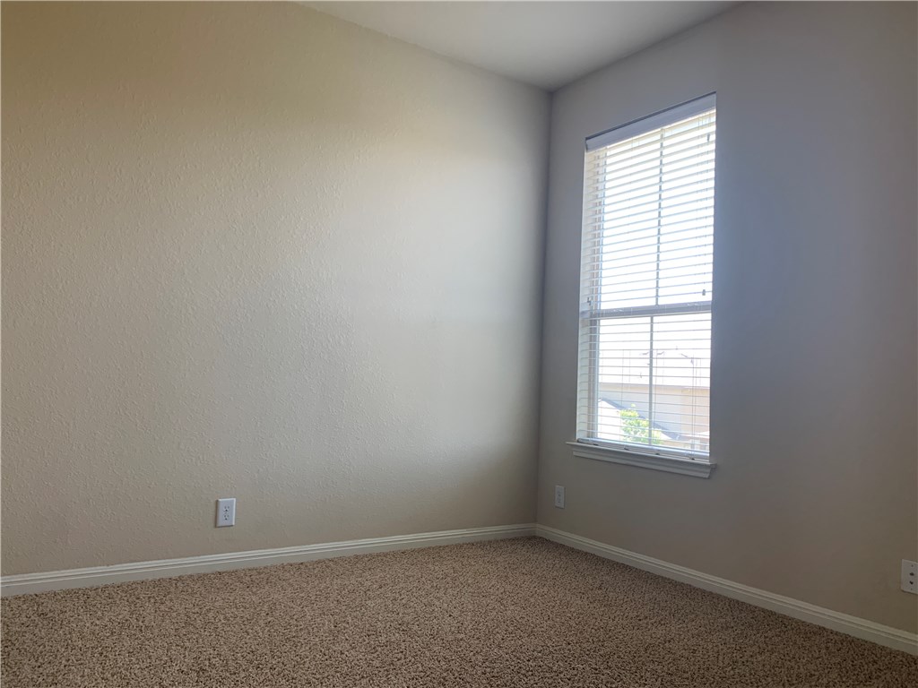 14001 Avery Ranch Boulevard, Unit 2902 Austin, TX 78717 - Photo 10 of 14 an empty room with a window