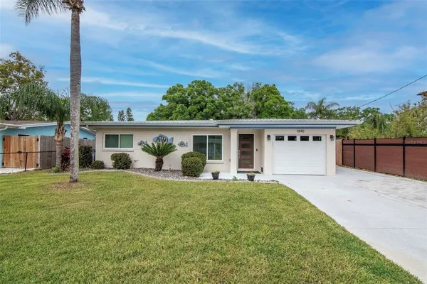 an empty room with wooden floor and a window
