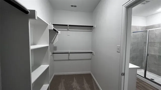 a view of an empty walk in closet