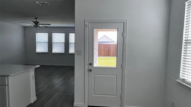 an empty room that has a window