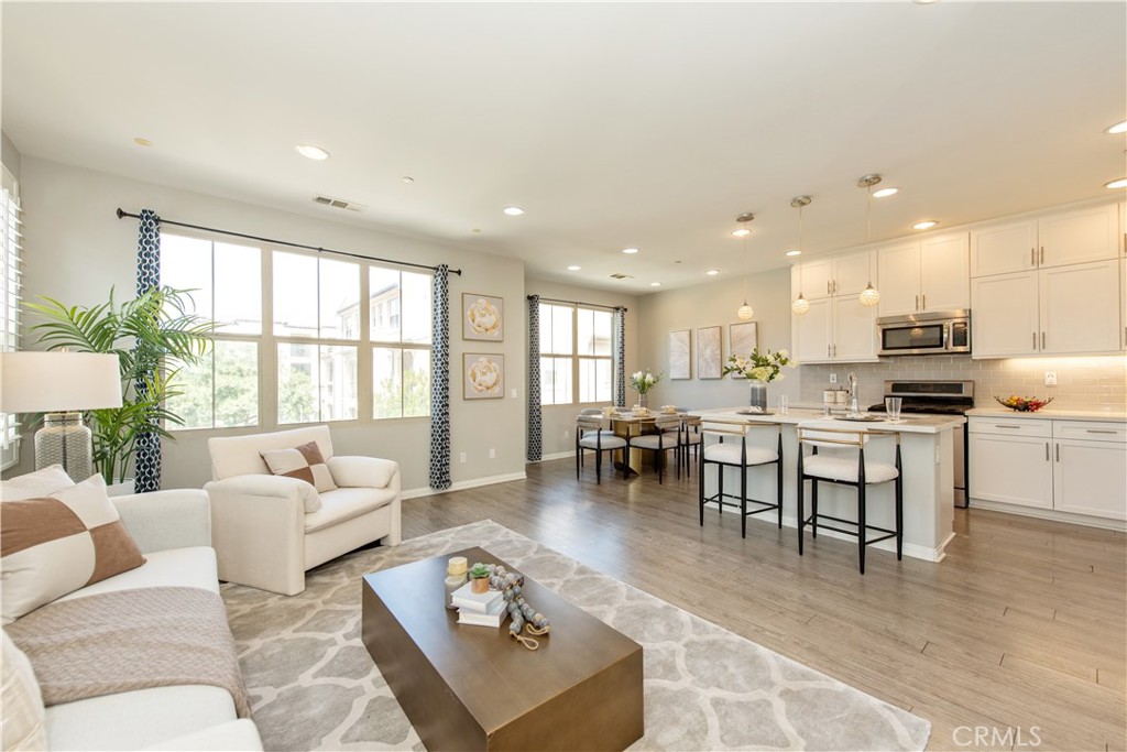 68 Origin Irvine, CA 92618 - Photo 8 of 43 a living room with furniture and kitchen view with a large window