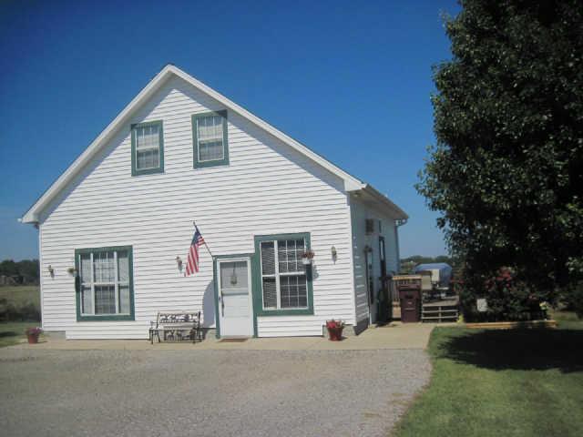 6526 Beckwith Road Mount Juliet, TN 37122 - Photo 1 of 13 a view of a house with a yard and garage