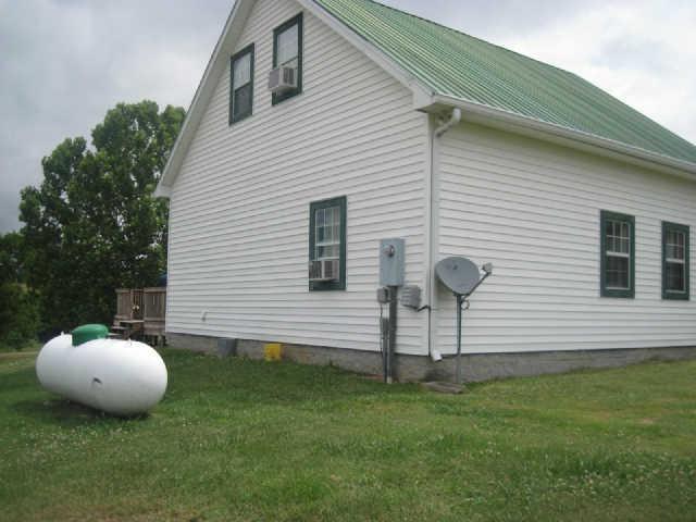 6526 Beckwith Road Mount Juliet, TN 37122 - Photo 3 of 13 a view of a backyard with a barbeque grill and plants