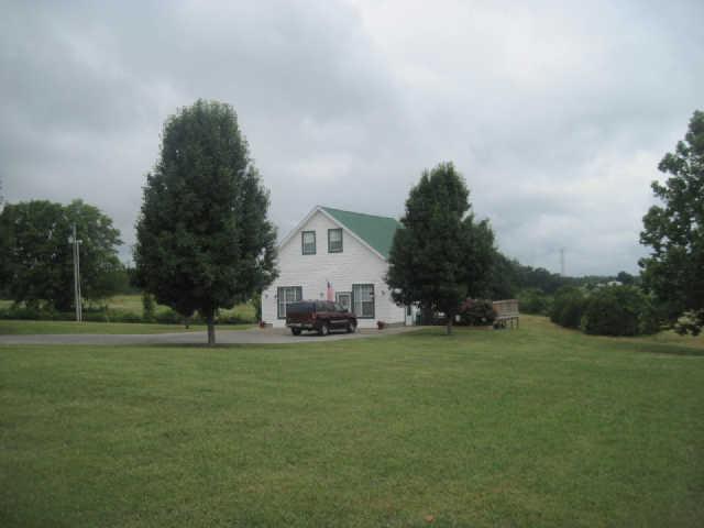 6526 Beckwith Road Mount Juliet, TN 37122 - Photo 4 of 13 a view of a house with a big yard and large trees