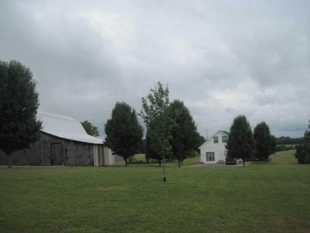 6526 Beckwith Road Mount Juliet, TN 37122 - Photo 5 of 13 a view of a large garden with large trees and wooden fence