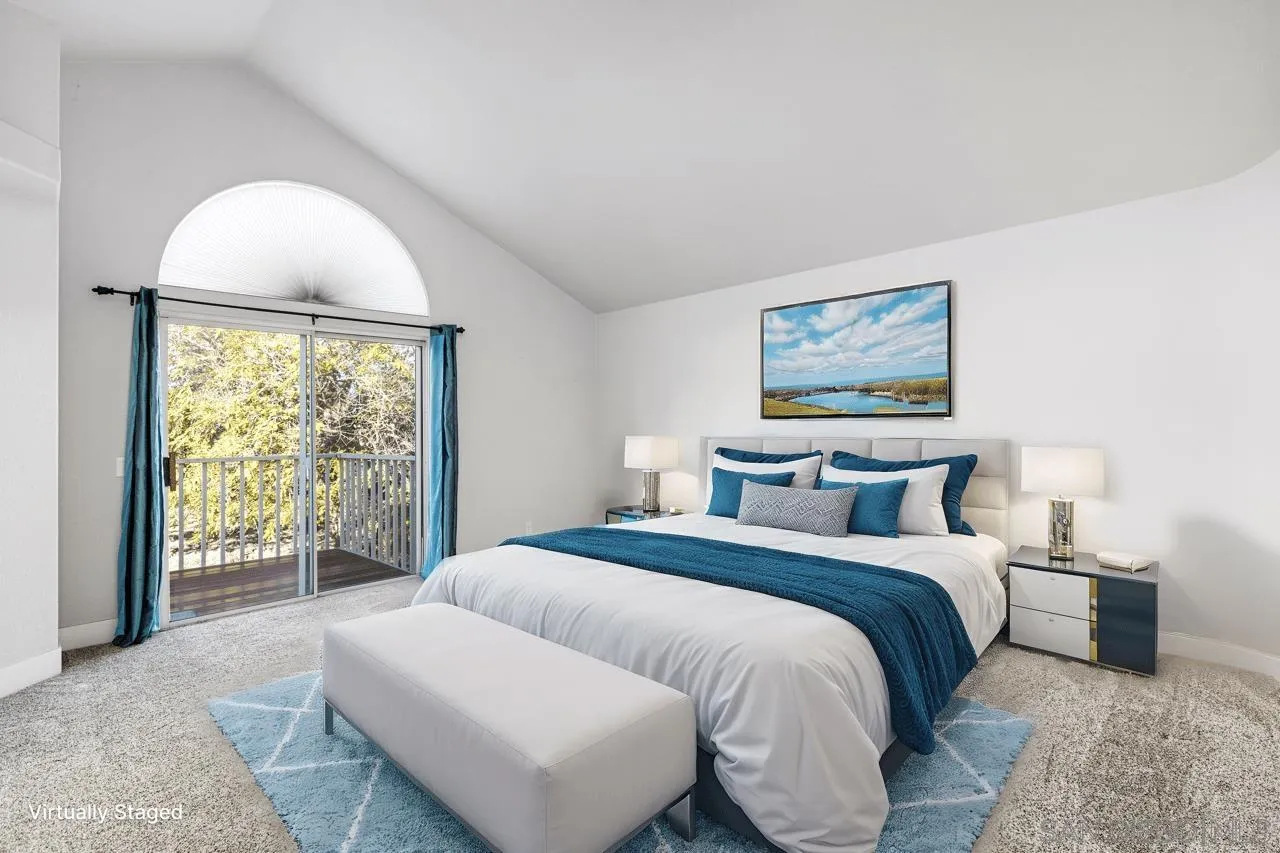 331 Vista Marazul Oceanside, CA 92057 - Photo 12 of 27 a bedroom with a large bed and a large window