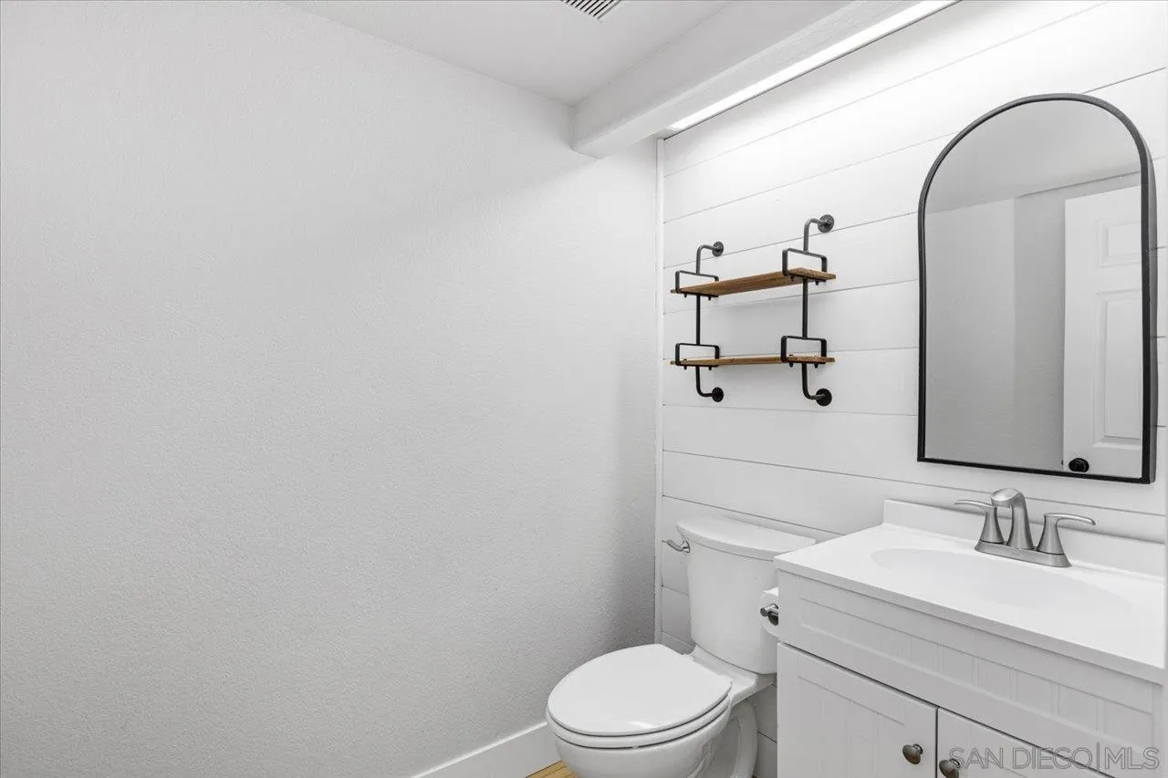 331 Vista Marazul Oceanside, CA 92057 - Photo 16 of 27 a bathroom with a sink vanity mirror and toilet