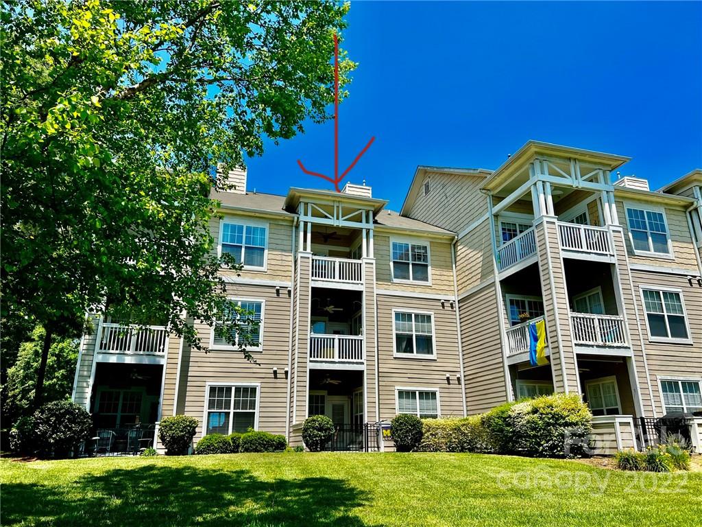 18742 Nautical Drive, Unit 305 Cornelius, NC 28031 - Photo 1 of 30 a front view of a house with a yard