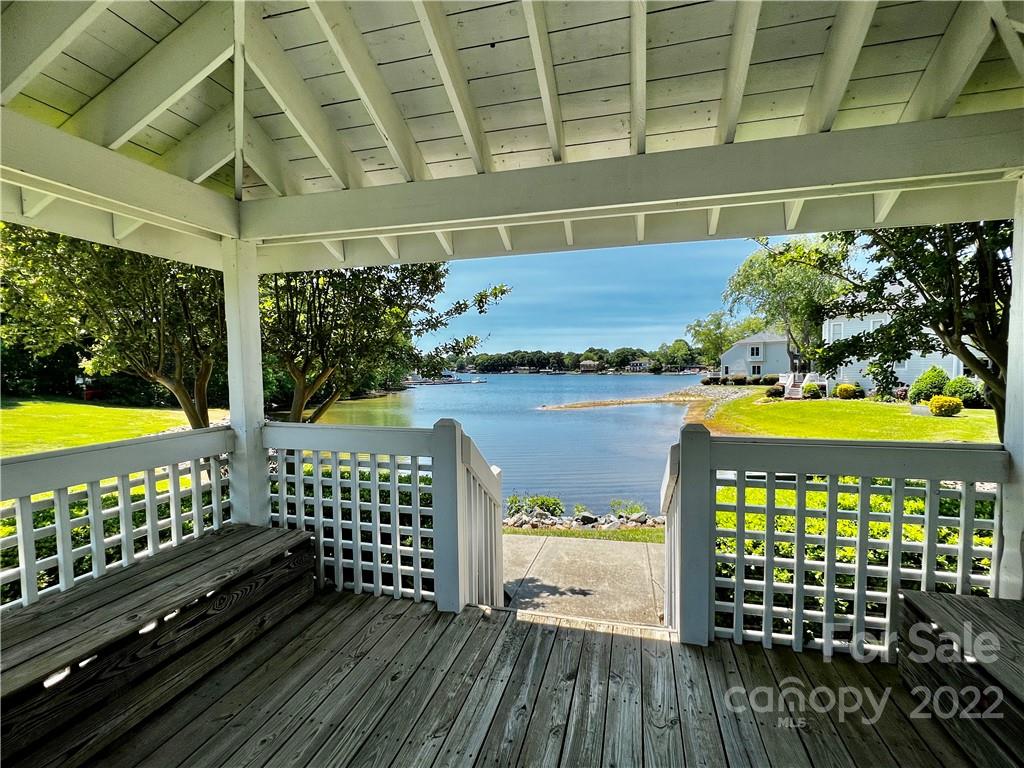 18742 Nautical Drive, Unit 305 Cornelius, NC 28031 - Photo 21 of 30 a view of a chairs and table on the wooden floor