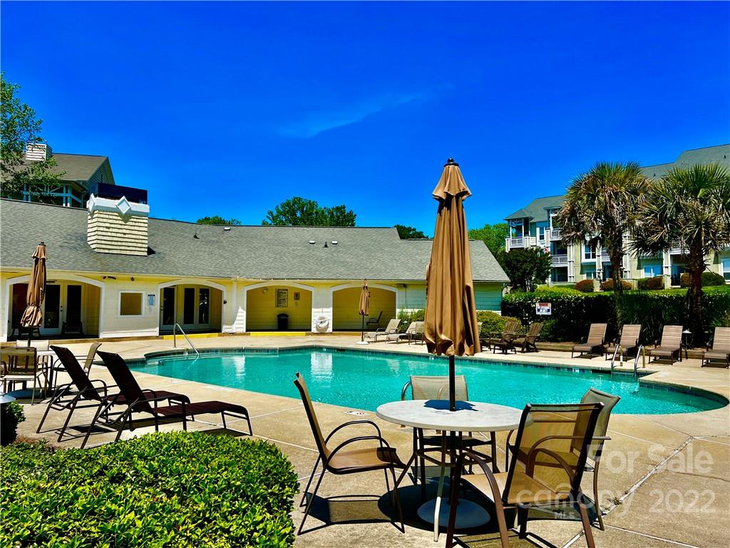 18742 Nautical Drive, Unit 305 Cornelius, NC 28031 - Photo 23 of 30 a patio with table and chairs