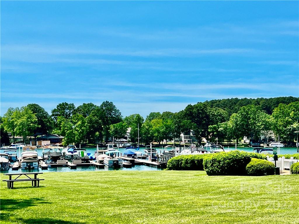 18742 Nautical Drive, Unit 305 Cornelius, NC 28031 - Photo 27 of 30 a view of swimming pool with seating area and trees in the background