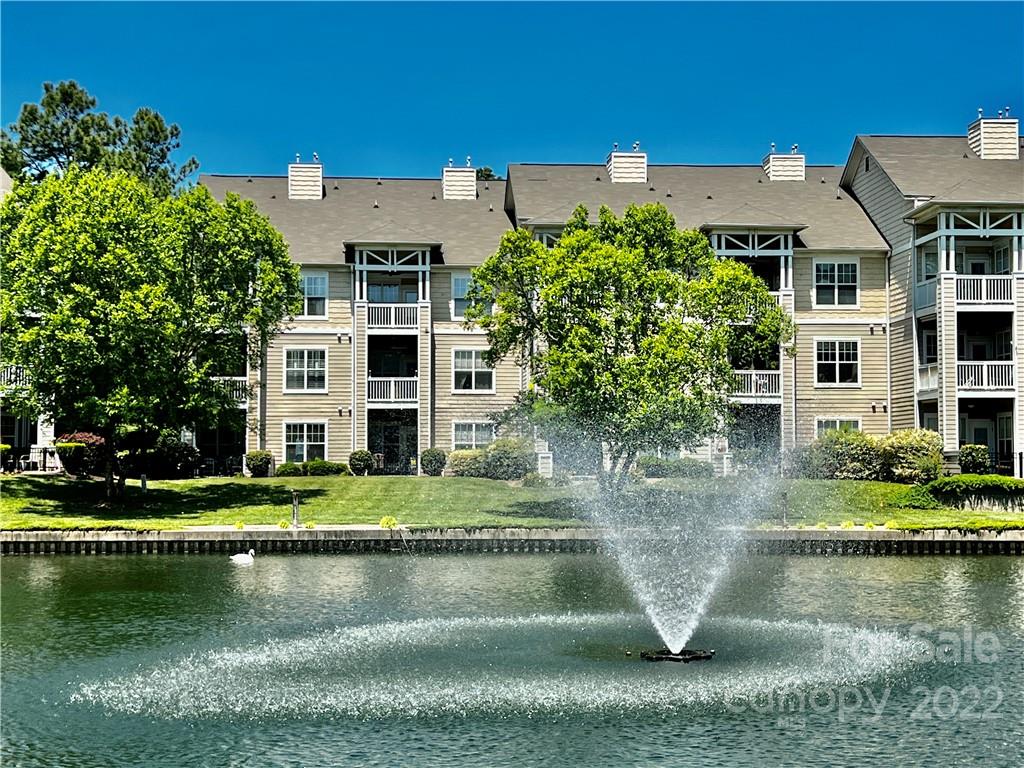 18742 Nautical Drive, Unit 305 Cornelius, NC 28031 - Photo 3 of 30 a view of a house with a yard