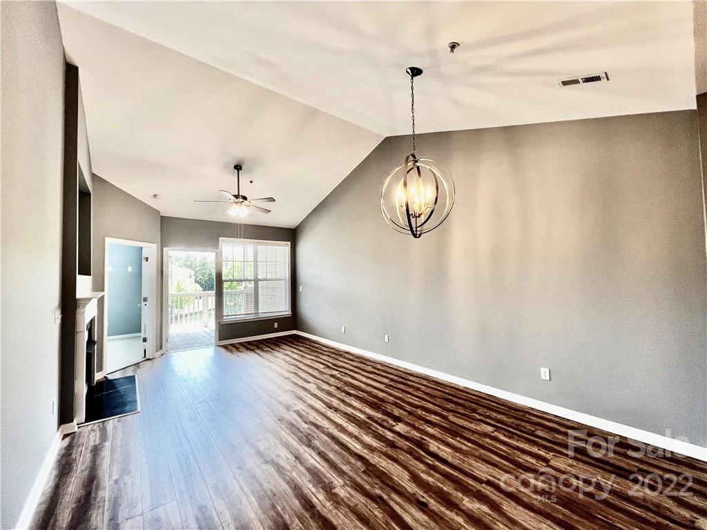 18742 Nautical Drive, Unit 305 Cornelius, NC 28031 - Photo 9 of 30 an empty room with wooden floor and windows