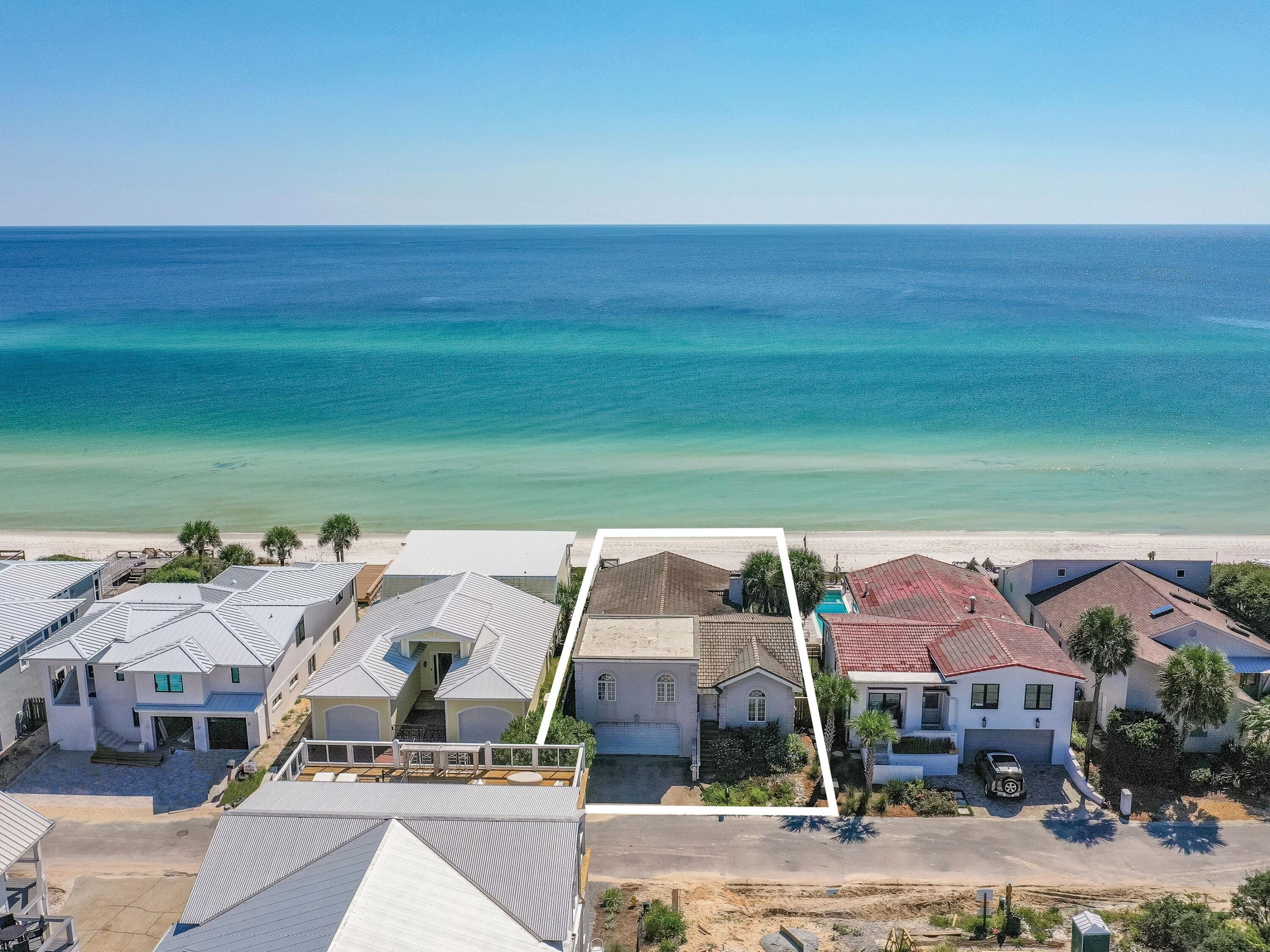 250 Sand Cliffs Drive Inlet Beach, FL 32461 - Photo 4 of 35 a front view of a house with a garden