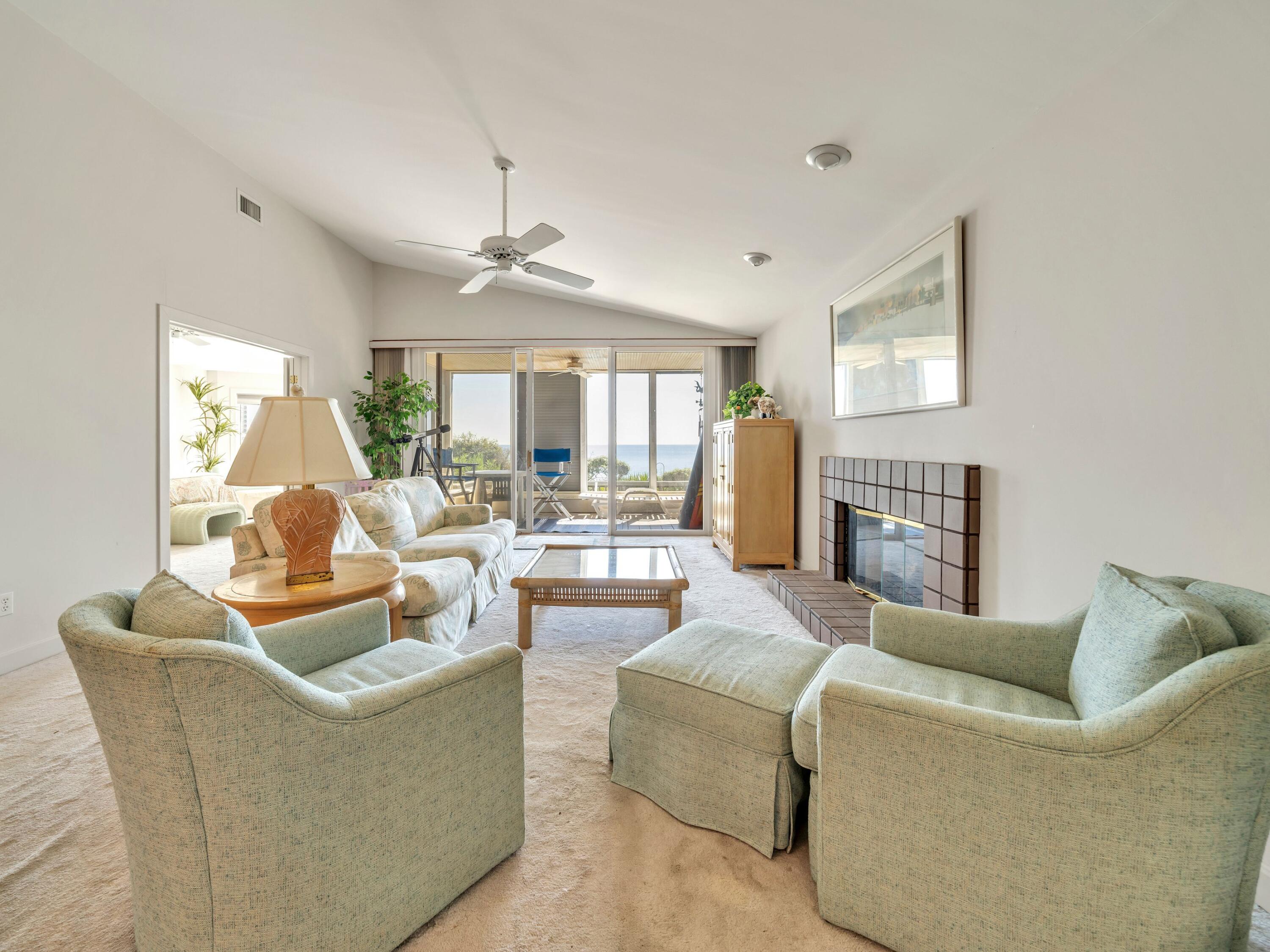 250 Sand Cliffs Drive Inlet Beach, FL 32461 - Photo 8 of 35 a living room with fireplace furniture and a large window
