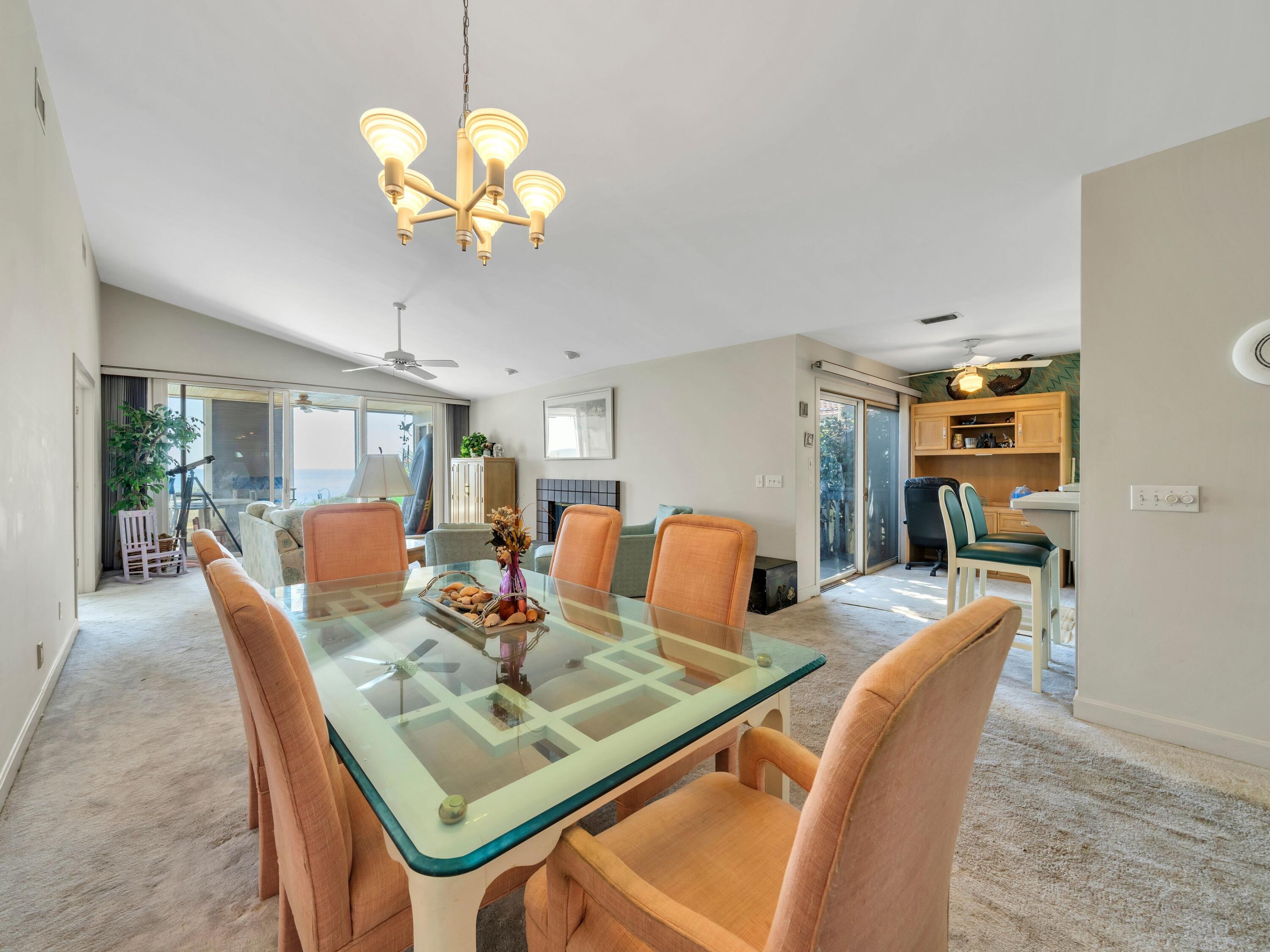250 Sand Cliffs Drive Inlet Beach, FL 32461 - Photo 10 of 35 a dining room filled chandelier and wooden floor