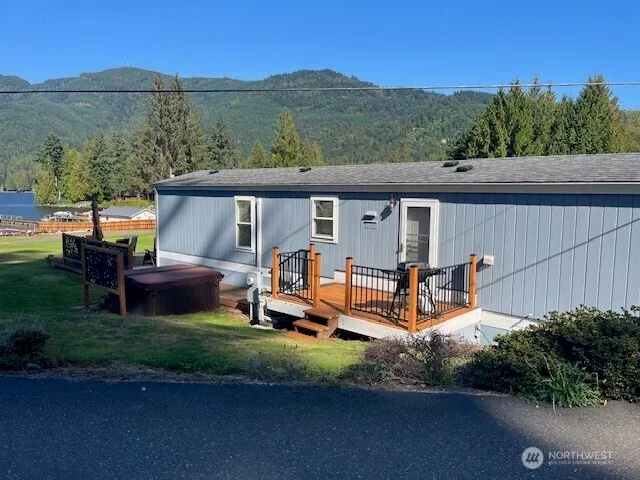 a view of a chairs and table in backyard of the house