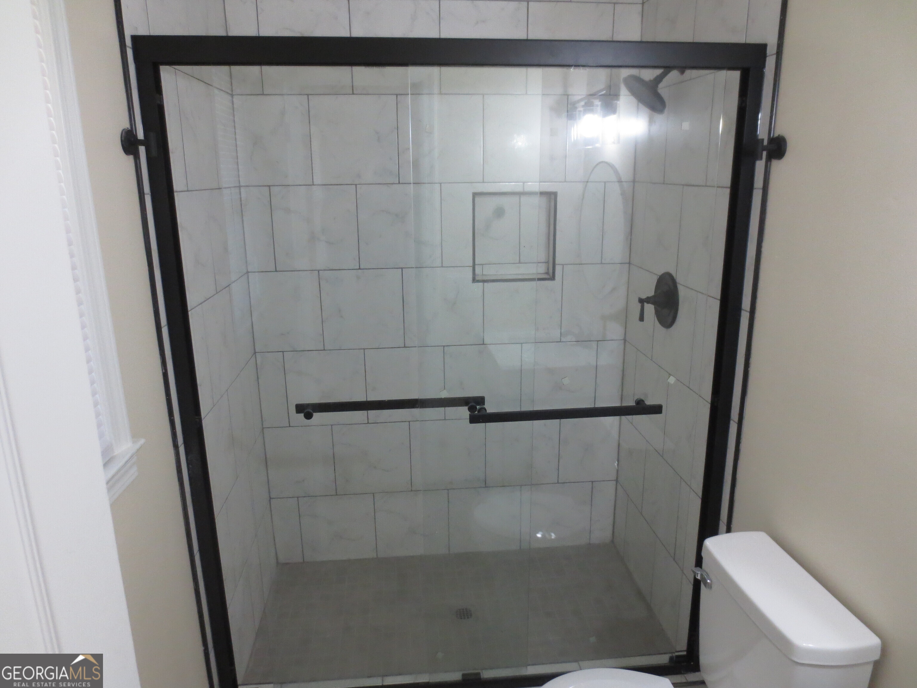 141 Wall Street Warner Robins, GA 31088 - Photo 11 of 16 a bathroom with a shower