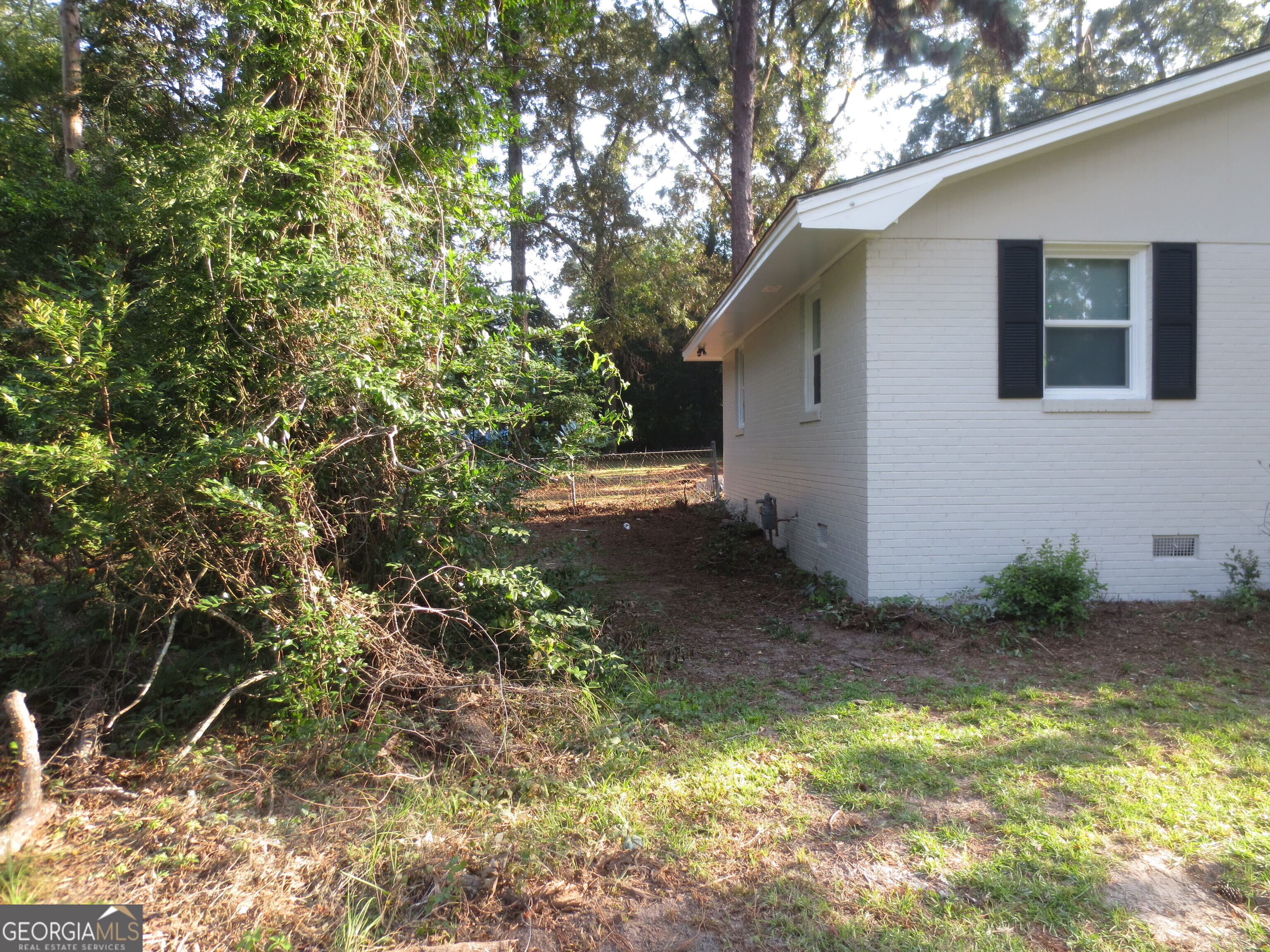 141 Wall Street Warner Robins, GA 31088 - Photo 12 of 16 a backyard of a house with lots of green space