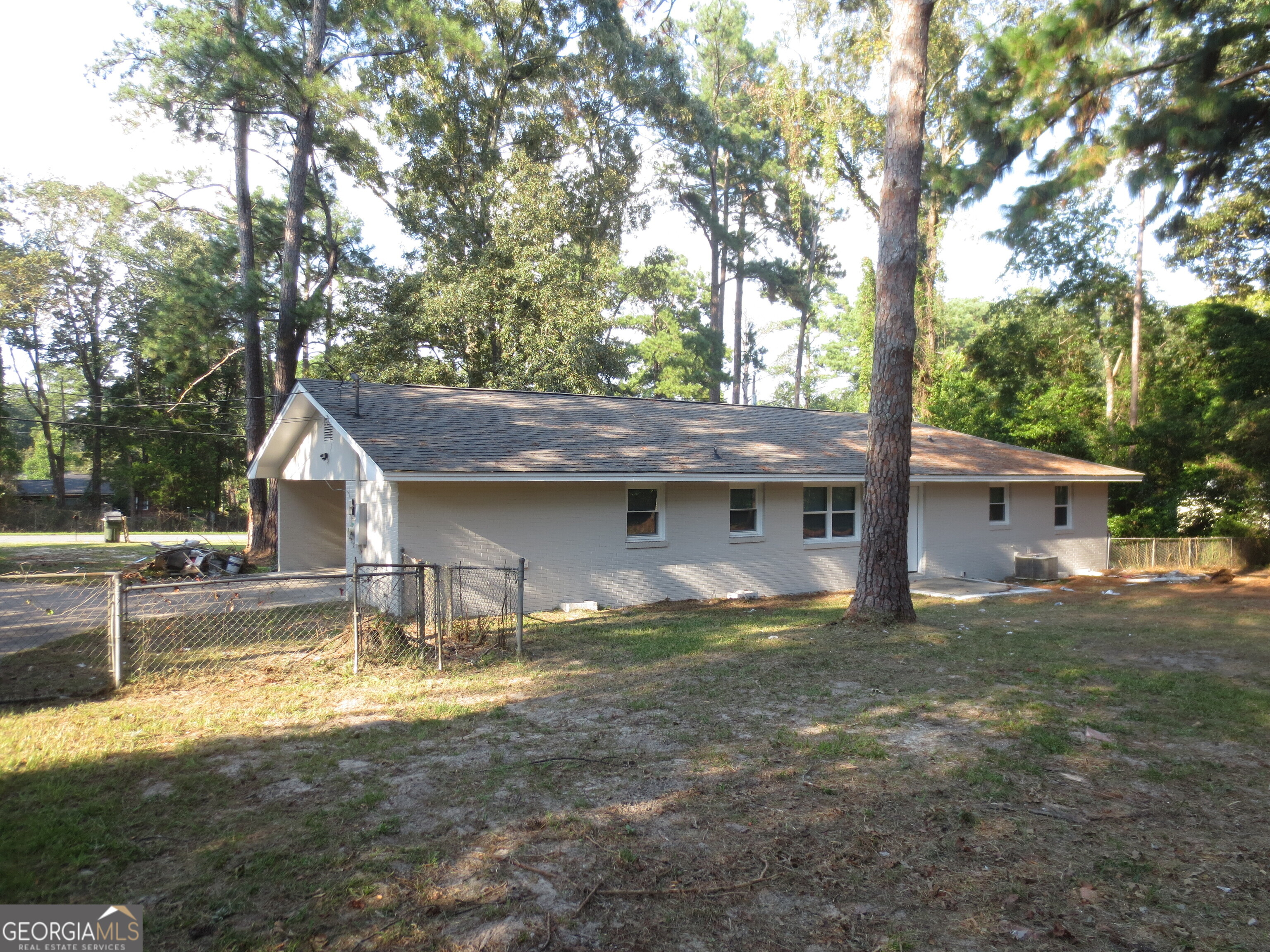 141 Wall Street Warner Robins, GA 31088 - Photo 15 of 16 a house view with a sitting space and a large tree