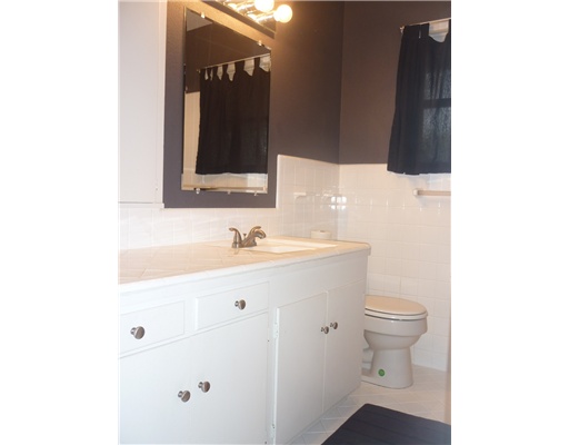 3722 Fort Worth Street Corpus Christi, TX 78411 - Photo 4 of 4 a bathroom with a sink toilet and mirror