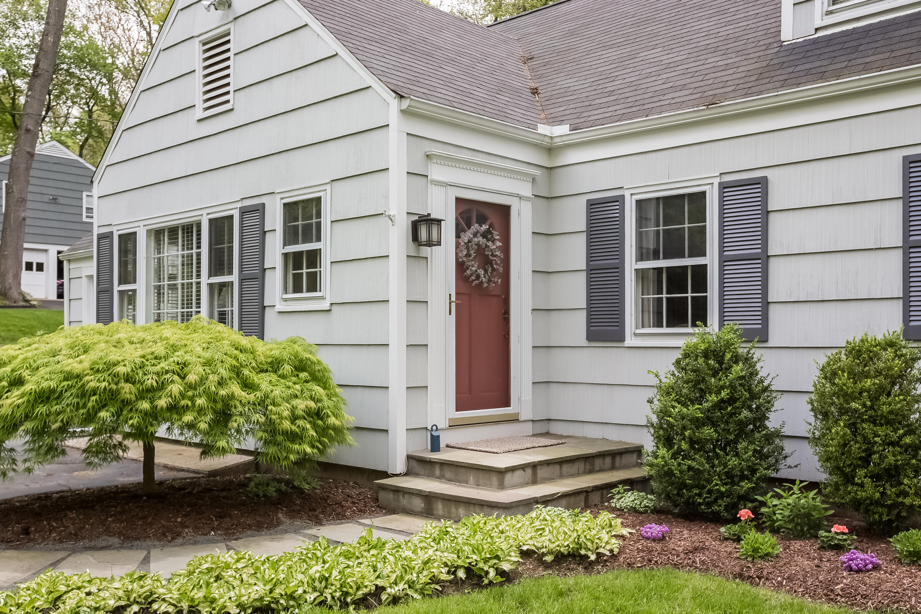 7 Briar Brae Road Darien, CT 06820 - Photo 2 of 35 front view of a house with a garden