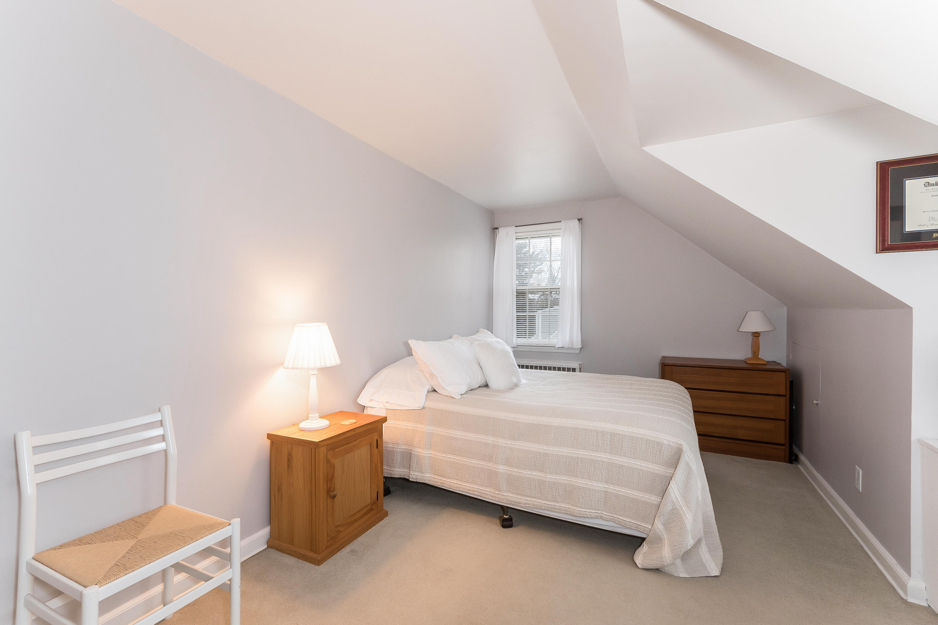 7 Briar Brae Road Darien, CT 06820 - Photo 25 of 35 a bedroom with a bed and a window