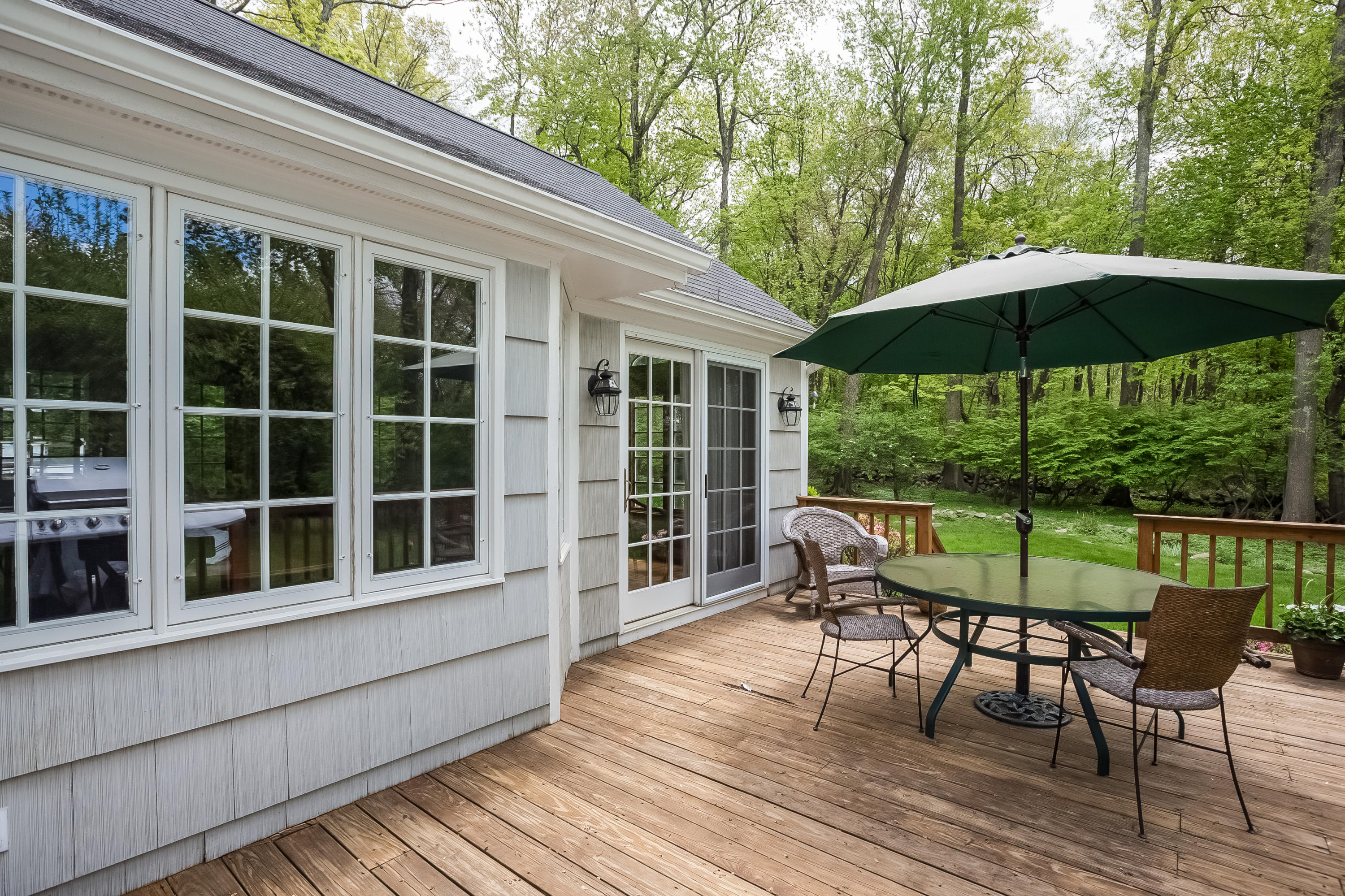 7 Briar Brae Road Darien, CT 06820 - Photo 29 of 35 a view of a chair and table on the deck