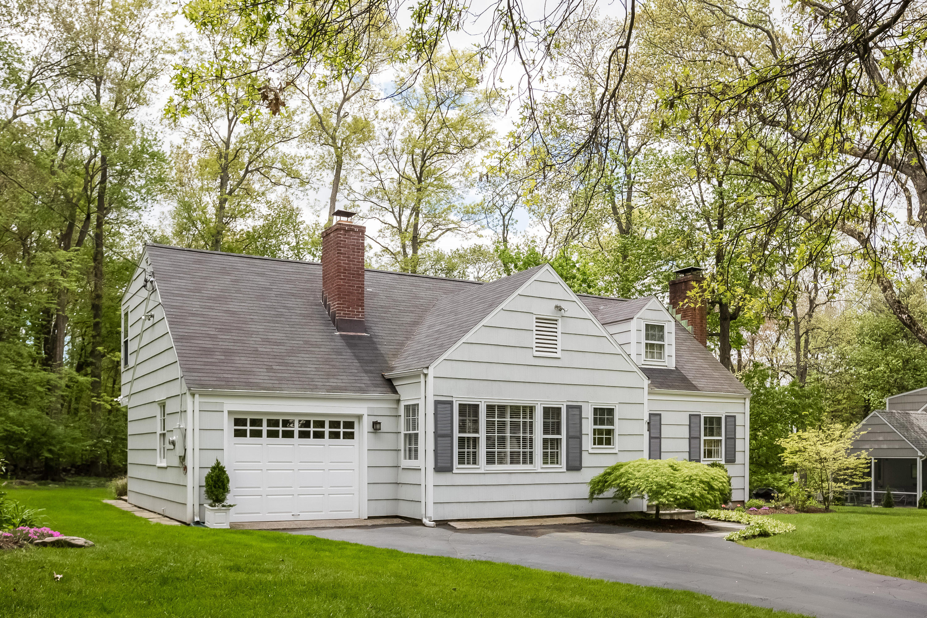 7 Briar Brae Road Darien, CT 06820 - Photo 3 of 35 a front view of a house with a garden