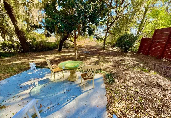 a view of a yard with wooden floor