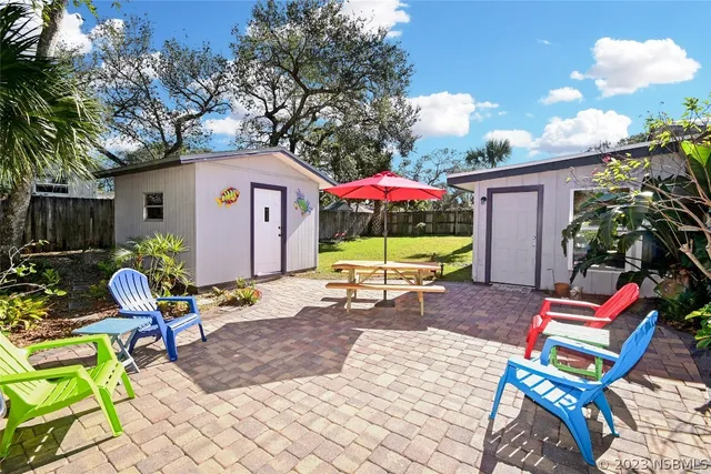 a view of chair and potted plant