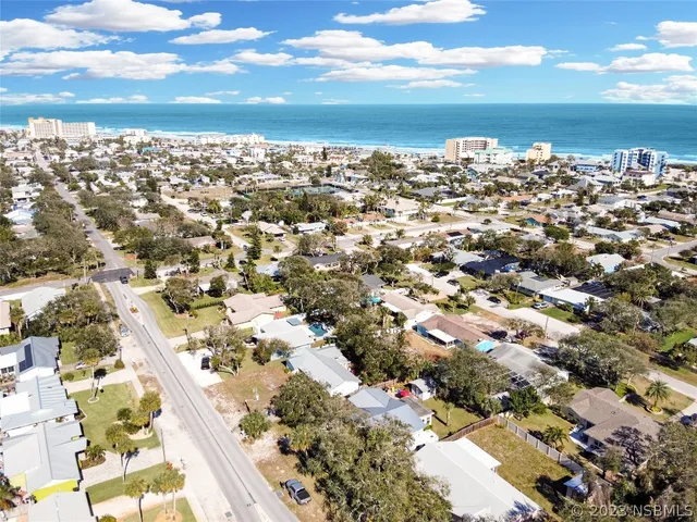 a bedroom with two beds and a dresser