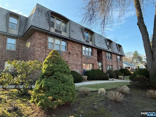a brick building with a yard