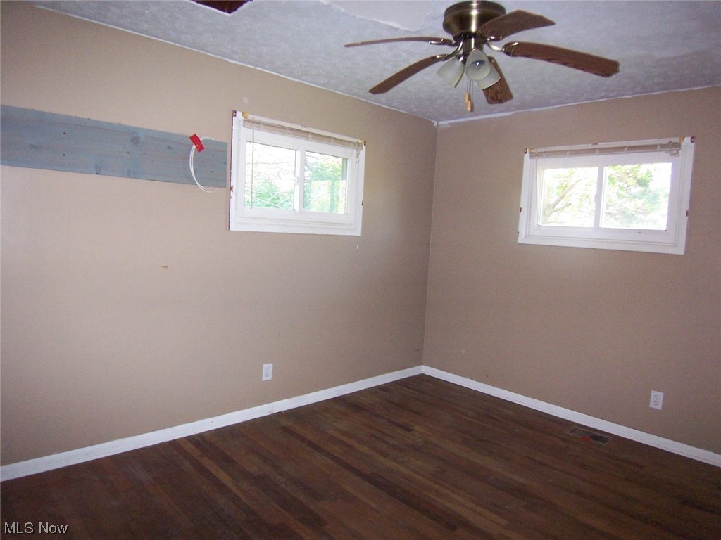 5968 Norwalk Road Medina, OH 44256 - Photo 5 of 12 Unfurnished bedroom featuring hardwood flooring and ceiling fan