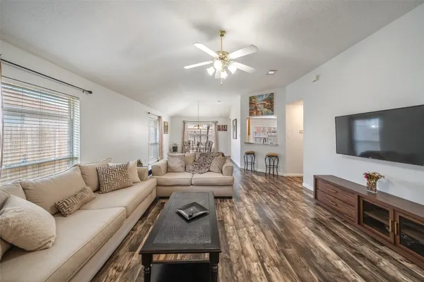 a living room with furniture and a flat screen tv
