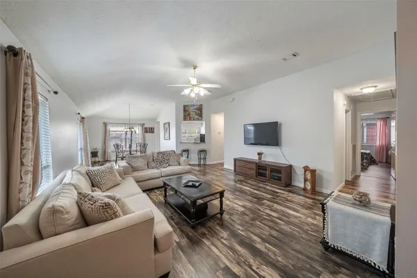 a living room with furniture and a flat screen tv