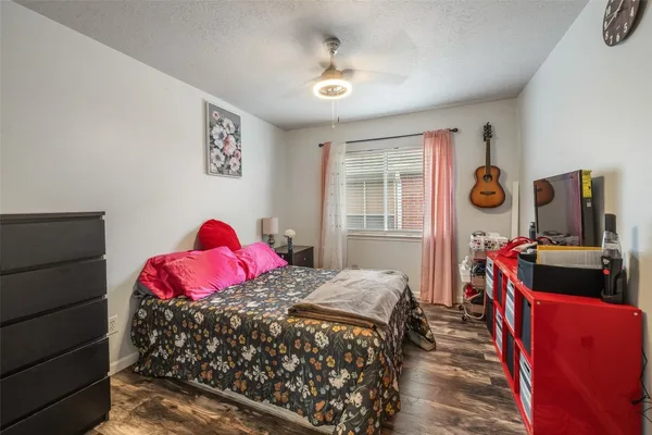 a bed room with a bed and a lamp