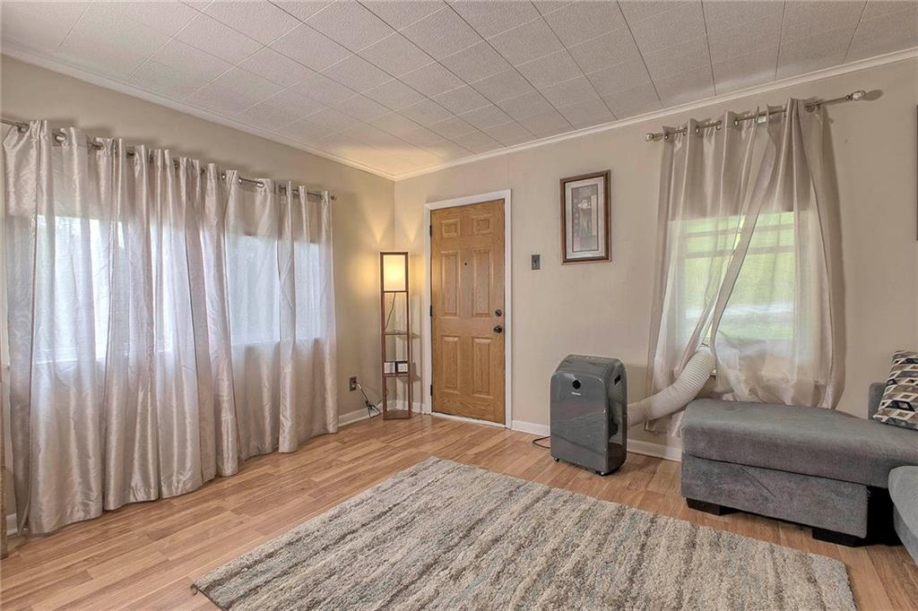 8002 Hayward Street Irwin, PA 15642 - Photo 8 of 31 a bedroom with furniture and a window