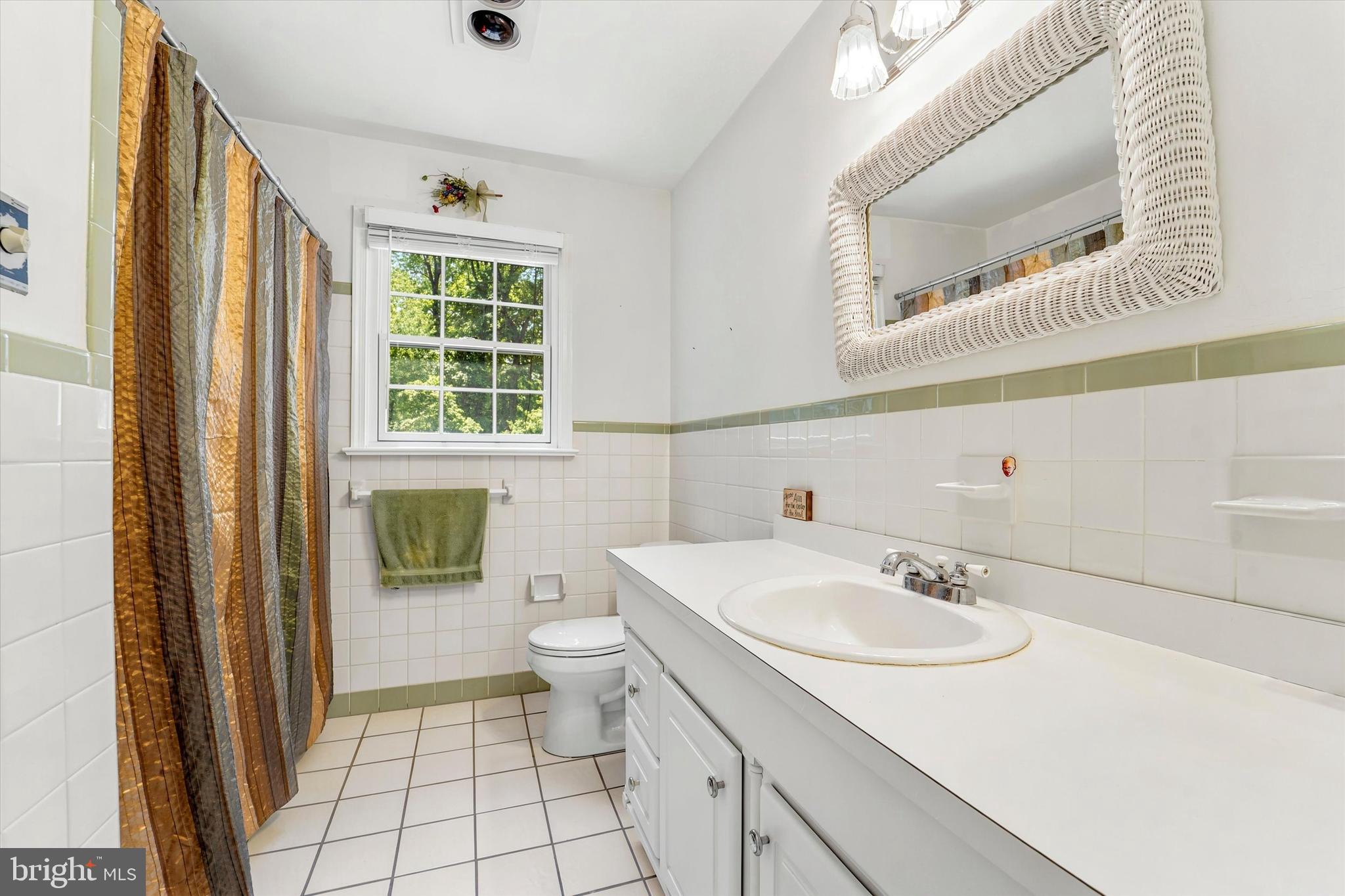 1980 Terwood Road Huntingdon Valley, PA 19006 - Photo 32 of 48 a bathroom with a sink toilet and mirror