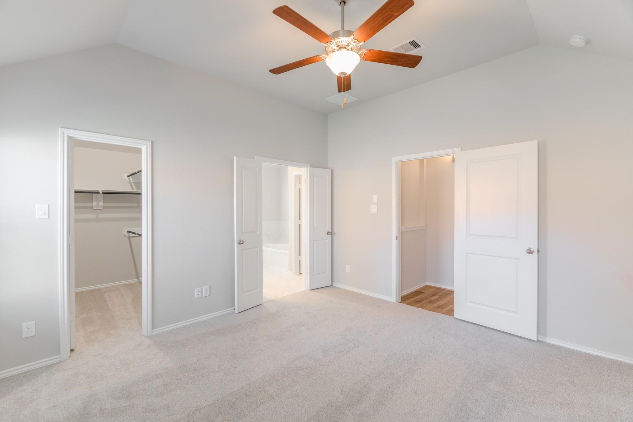 7427 Caprock Cyn Lane Porter, TX 77365 - Photo 12 of 21 an empty room with closet and a ceiling fan