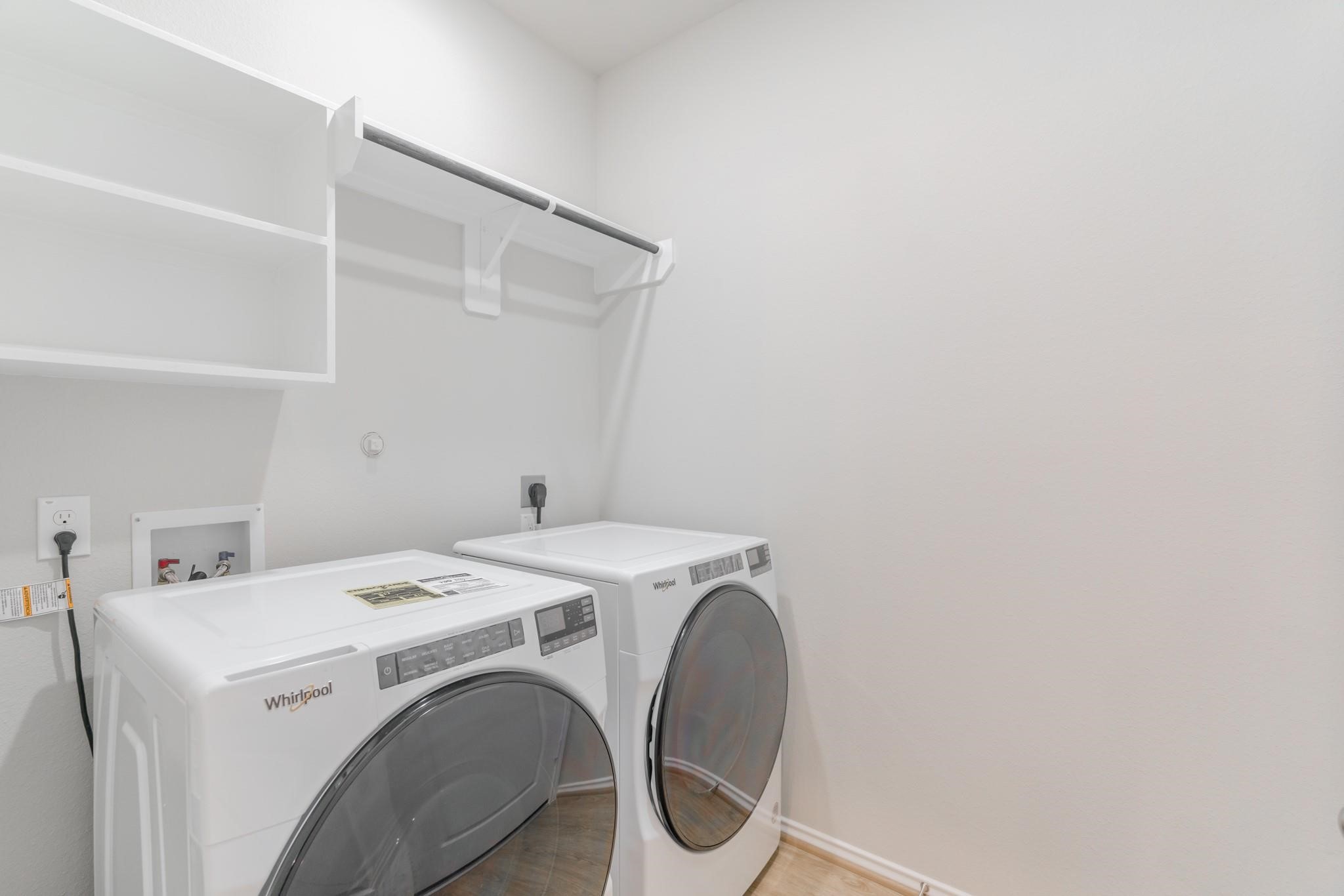 7427 Caprock Cyn Lane Porter, TX 77365 - Photo 14 of 21 a utility room with dryer and washer