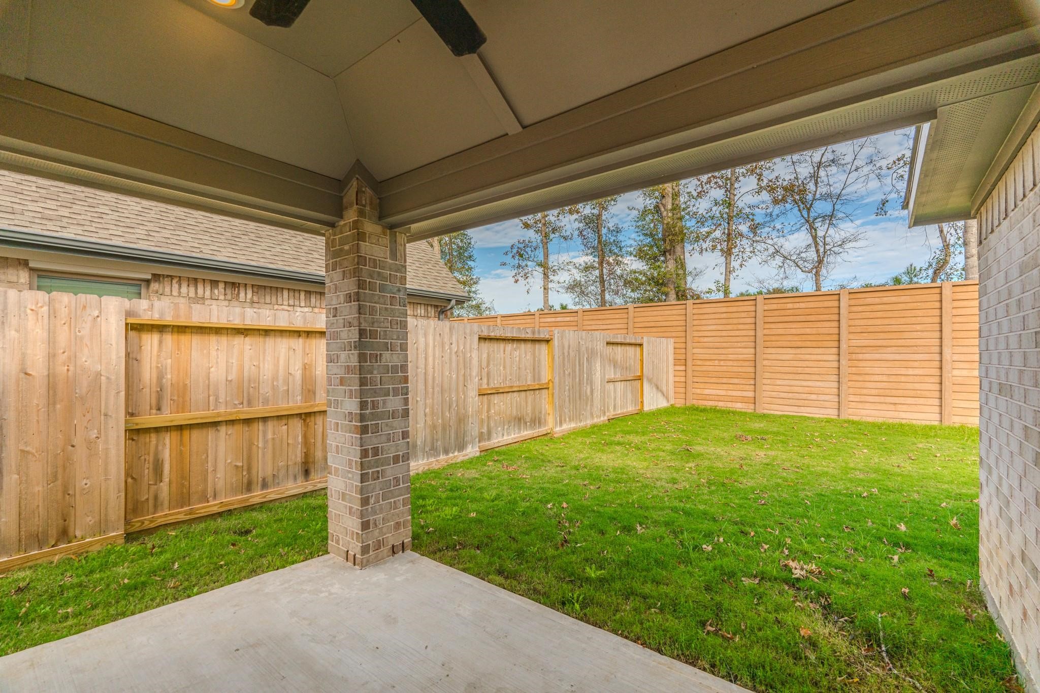 7427 Caprock Cyn Lane Porter, TX 77365 - Photo 15 of 21 a view of a backyard with garden
