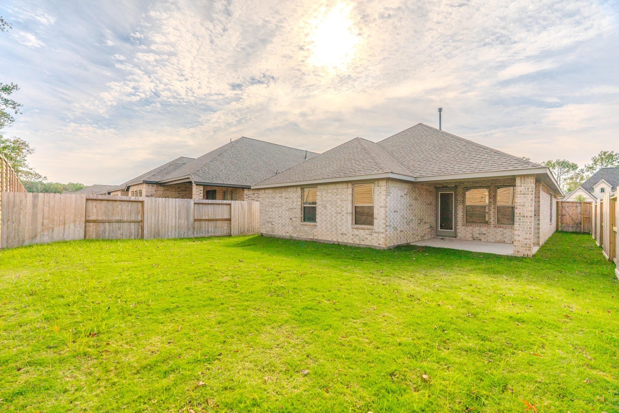 7427 Caprock Cyn Lane Porter, TX 77365 - Photo 16 of 21 a view of a yard in front of a house with a large tree