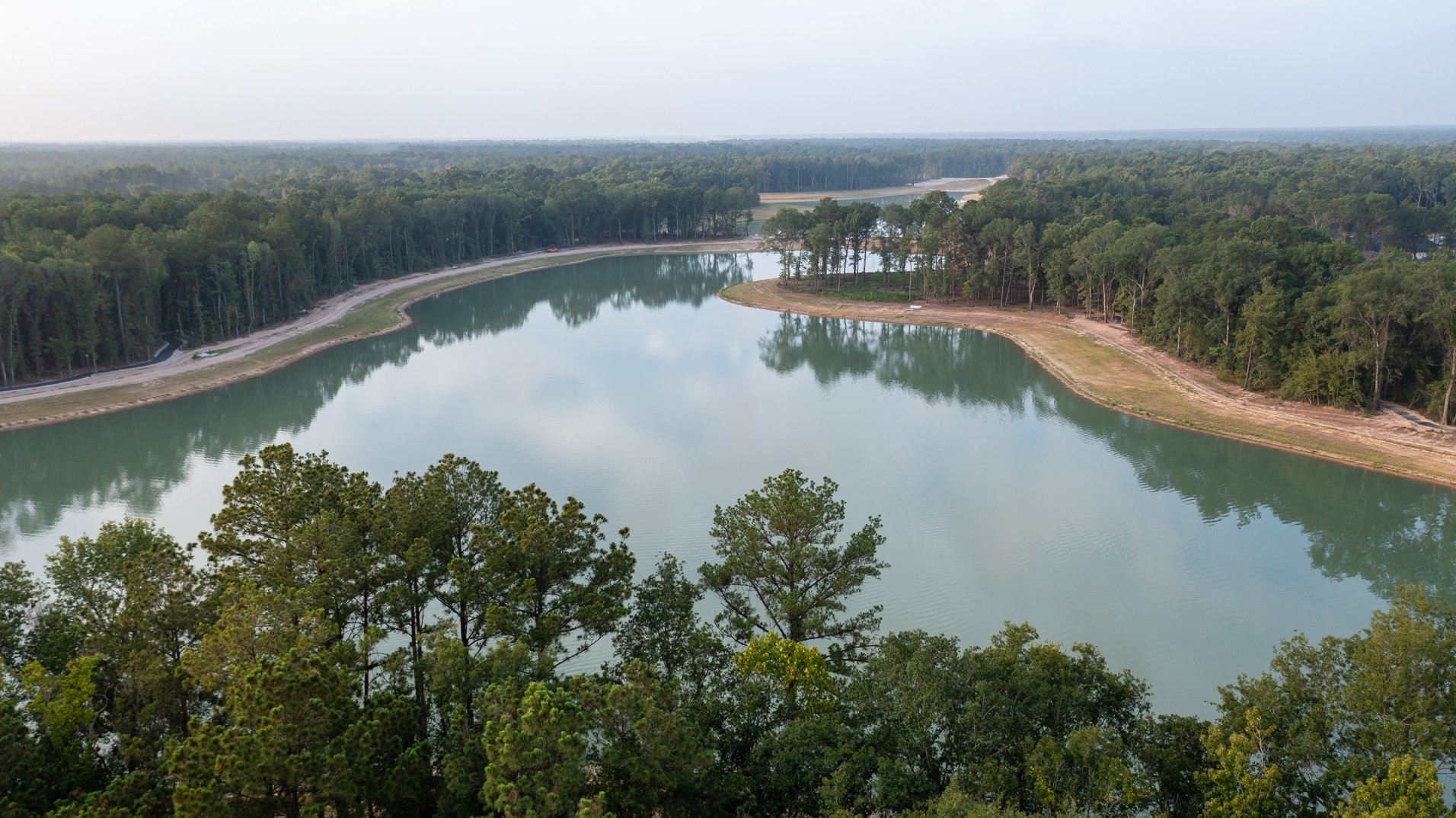 7427 Caprock Cyn Lane Porter, TX 77365 - Photo 20 of 21 an aerial view of a house with a lake view