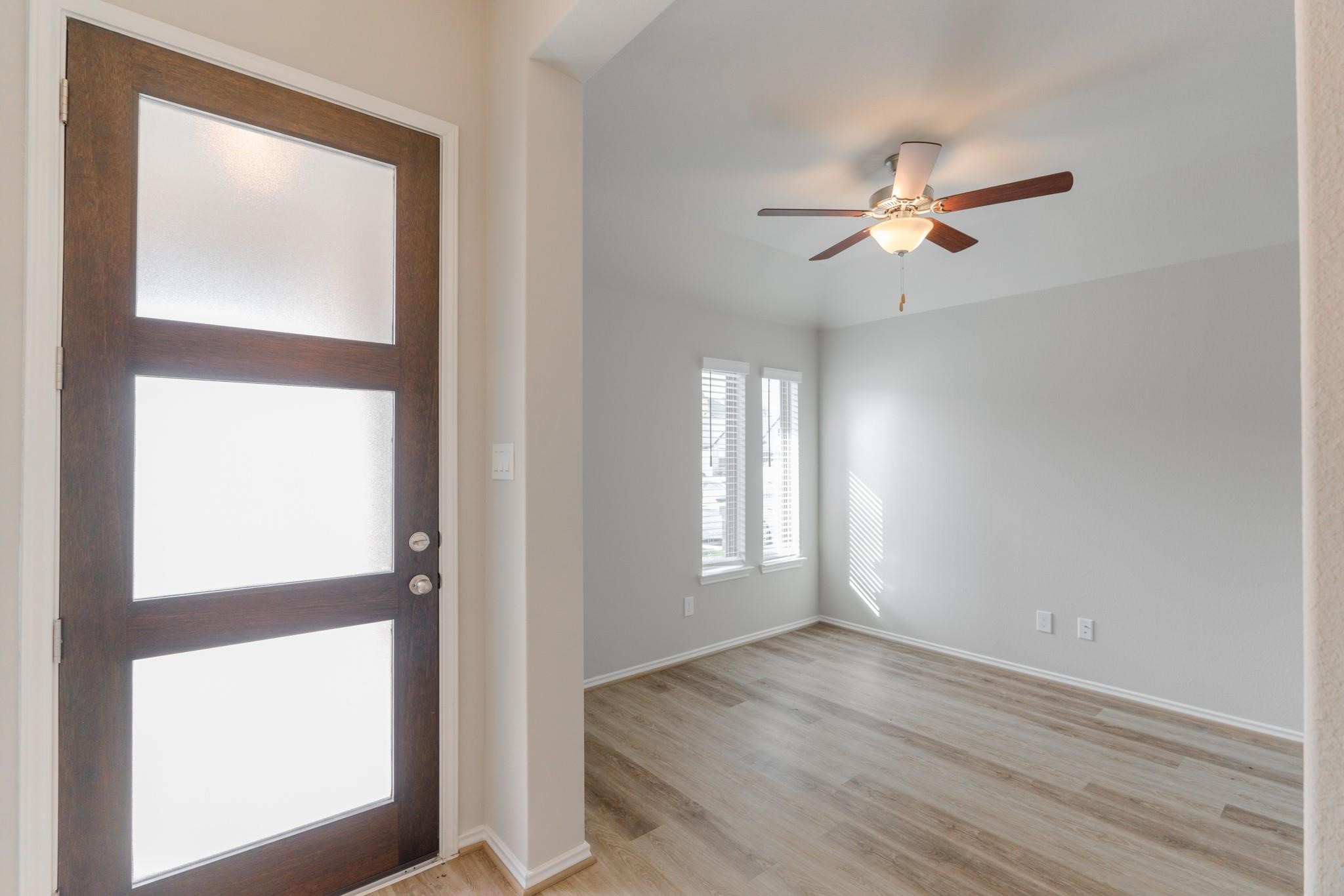 7427 Caprock Cyn Lane Porter, TX 77365 - Photo 3 of 21 a view of empty room with wooden floor and fan